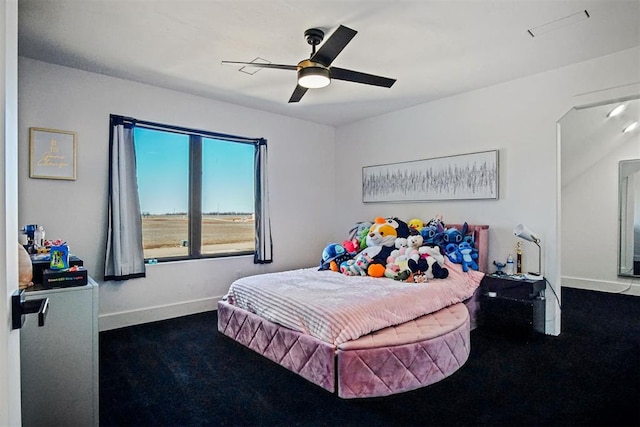 bedroom with ceiling fan and baseboards