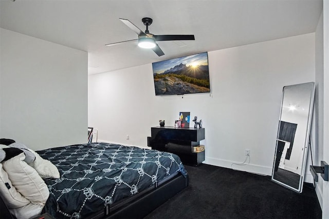 bedroom with ceiling fan, carpet floors, and baseboards