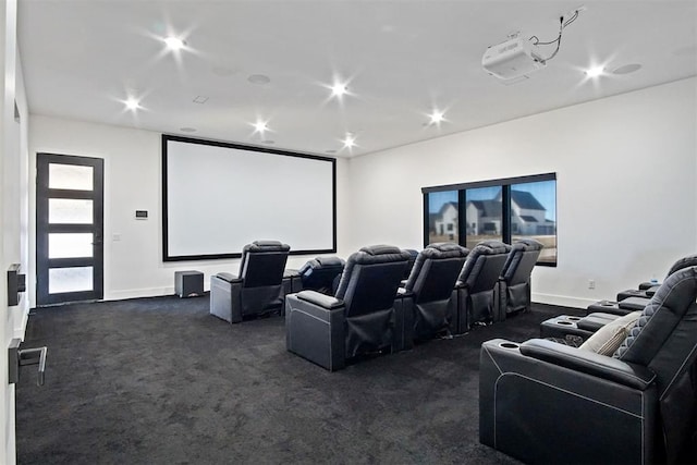 cinema room featuring dark colored carpet, baseboards, and recessed lighting