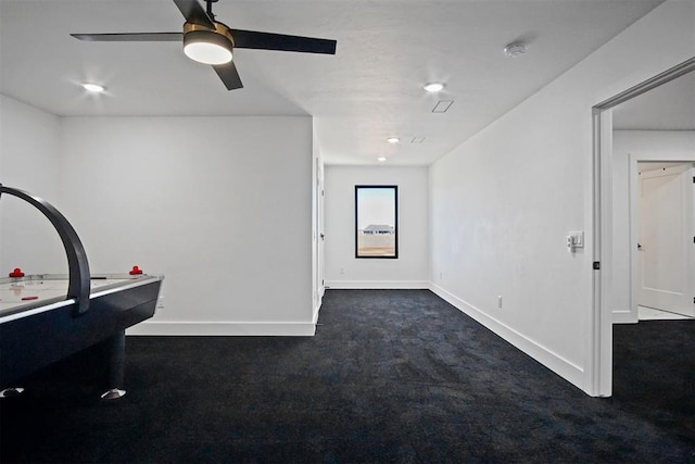 playroom featuring ceiling fan and baseboards