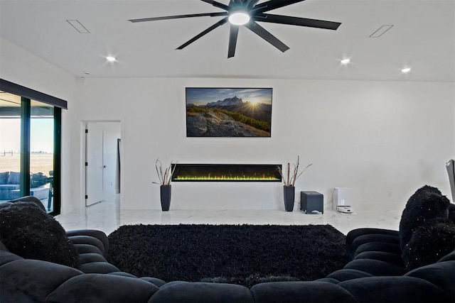 living room with a warm lit fireplace, marble finish floor, ceiling fan, and recessed lighting