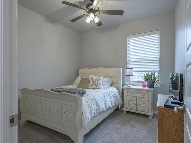 bedroom with a ceiling fan and light carpet