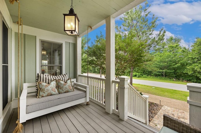 wooden deck featuring covered porch