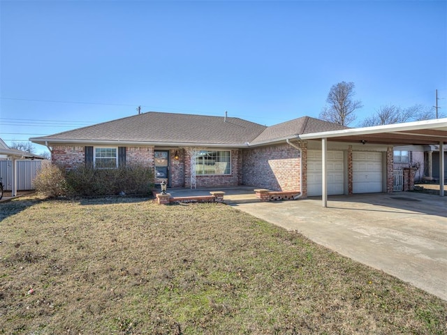 ranch-style home with a garage, a shingled roof, fence, a front yard, and brick siding