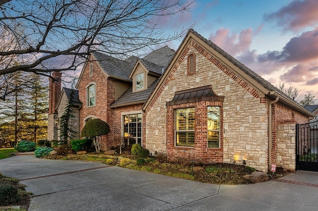 view of side of home with brick siding