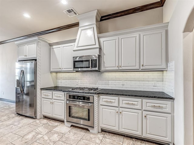 kitchen featuring visible vents, stainless steel appliances, decorative backsplash, and ornamental molding