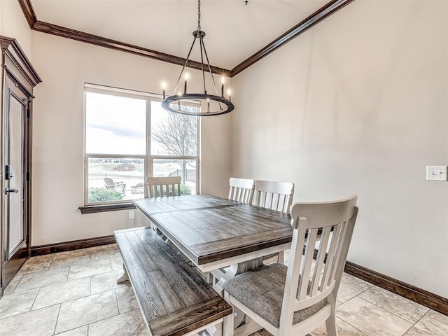 dining space featuring a chandelier, crown molding, and baseboards