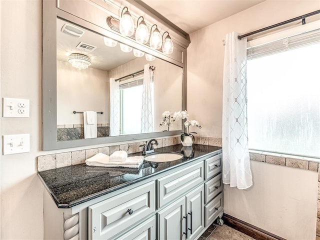 bathroom with visible vents and vanity