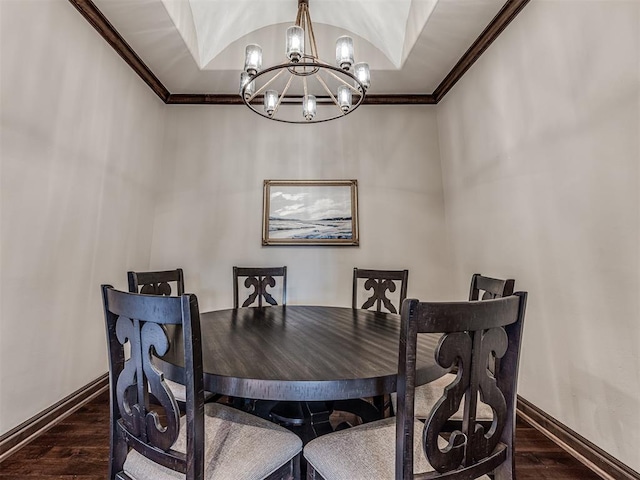 dining area featuring dark wood-style floors, baseboards, and crown molding