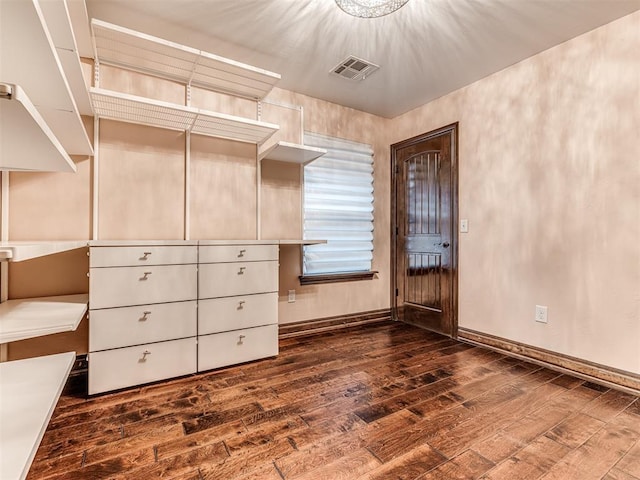 spacious closet with hardwood / wood-style floors and visible vents