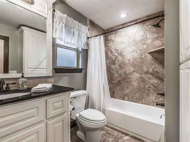 bathroom with toilet, shower / bath combo with shower curtain, and vanity