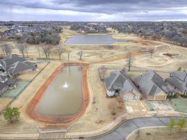 birds eye view of property with a residential view and a water view