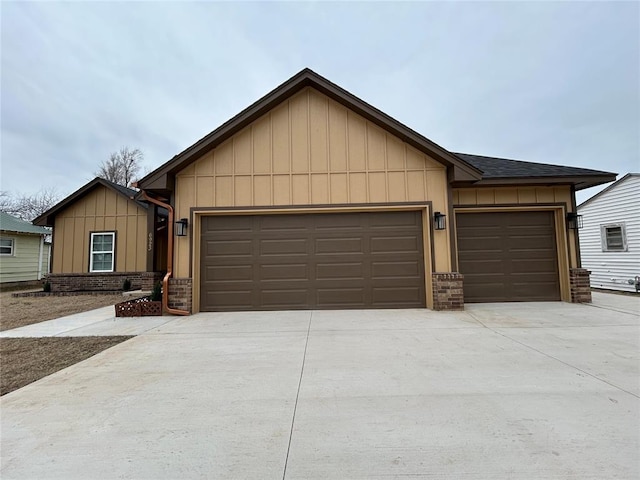 ranch-style house featuring an attached garage, board and batten siding, and brick siding