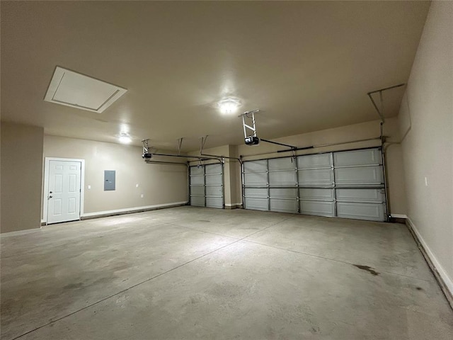 garage with baseboards, electric panel, and a garage door opener