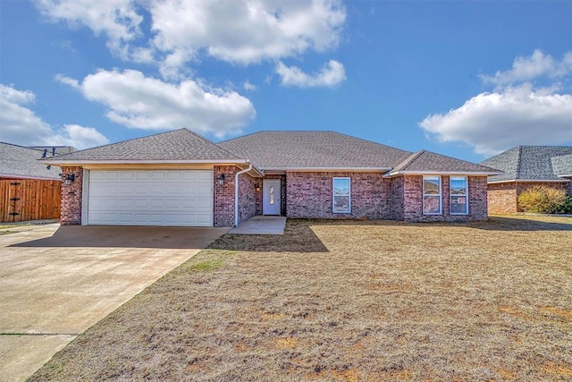 single story home featuring an attached garage, driveway, roof with shingles, and brick siding