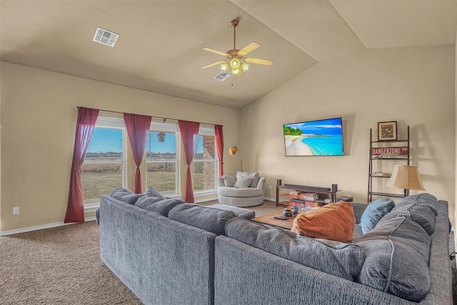 carpeted living area with ceiling fan, visible vents, vaulted ceiling, and baseboards