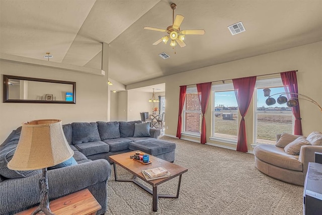 living area featuring vaulted ceiling, ceiling fan, carpet, and visible vents