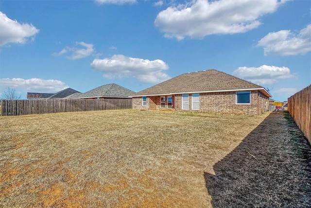 view of yard with a fenced backyard