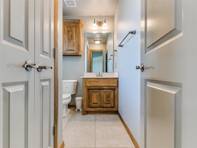 bathroom featuring visible vents, baseboards, toilet, tile patterned flooring, and vanity