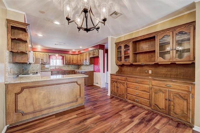 kitchen with an inviting chandelier, open shelves, a peninsula, and dark wood-style flooring