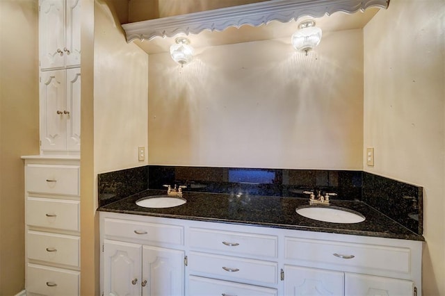 full bathroom with double vanity and a sink