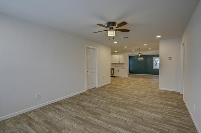 unfurnished room featuring recessed lighting, visible vents, ceiling fan, light wood-type flooring, and baseboards