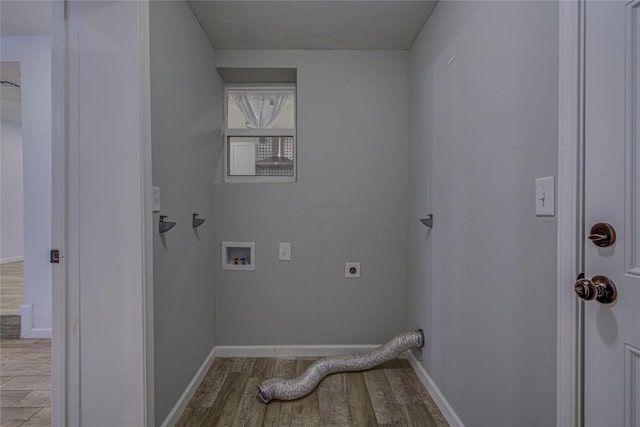 washroom featuring hookup for a washing machine, laundry area, wood finished floors, baseboards, and electric dryer hookup