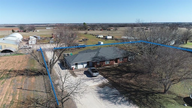 birds eye view of property featuring a rural view