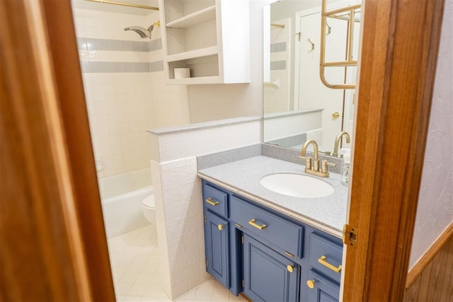 bathroom with toilet, tile patterned flooring, tub / shower combination, and vanity