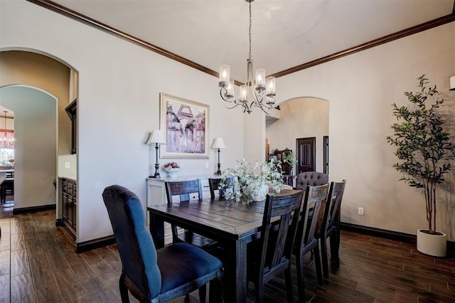 dining space featuring baseboards, ornamental molding, and dark wood-style flooring