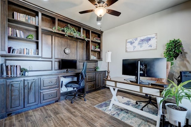 office area with ceiling fan and wood finished floors