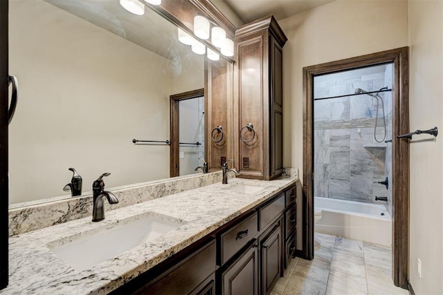 bathroom with double vanity, shower / washtub combination, a sink, and toilet