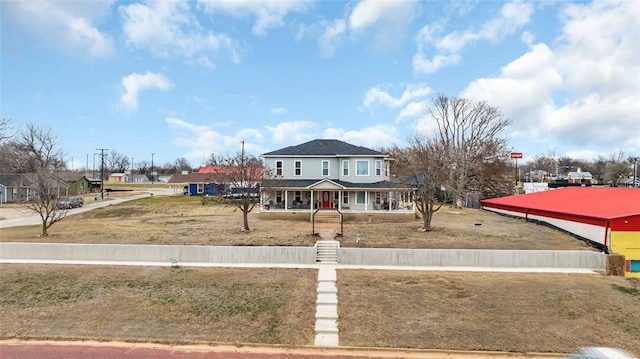 view of front facade featuring a fenced front yard