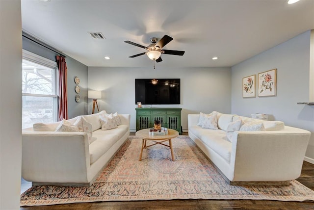 living area with recessed lighting, visible vents, a ceiling fan, wood finished floors, and baseboards