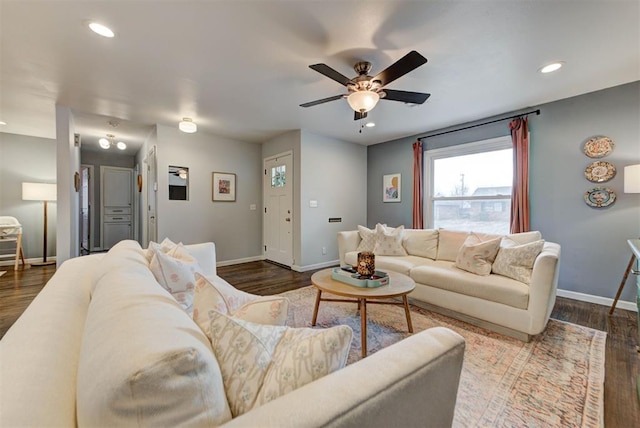 living room with baseboards, dark wood-style flooring, and recessed lighting