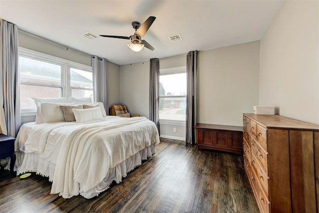 bedroom with a ceiling fan, baseboards, visible vents, and dark wood-style flooring