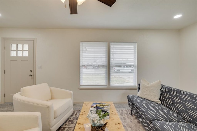 living room featuring a ceiling fan and recessed lighting