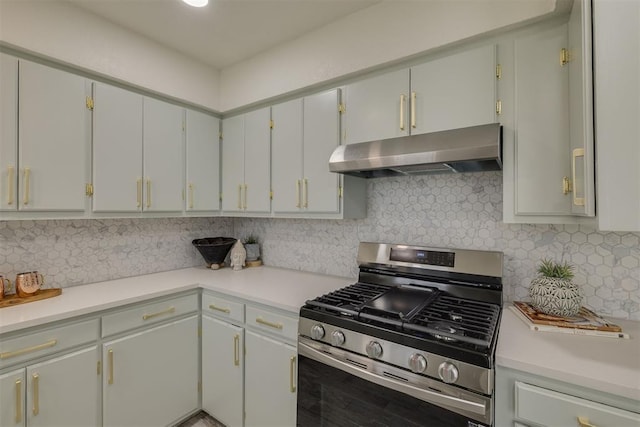 kitchen with light countertops, stainless steel range with gas stovetop, under cabinet range hood, and decorative backsplash