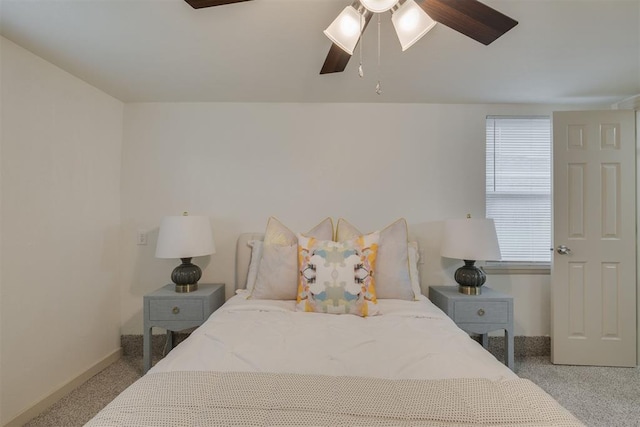 bedroom featuring ceiling fan, carpet floors, and baseboards