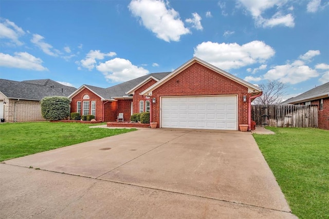 ranch-style house featuring brick siding, concrete driveway, a front yard, and fence