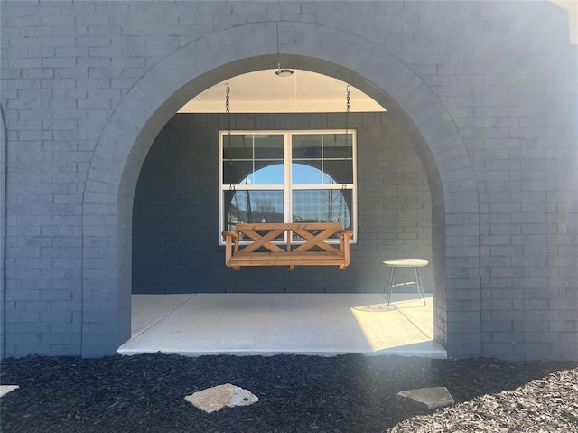 property entrance with brick siding