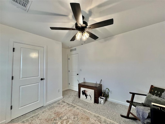 office featuring light carpet, baseboards, and visible vents