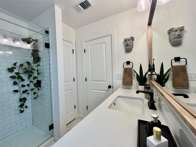 bathroom featuring a stall shower, visible vents, and vanity