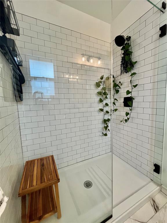 full bath featuring a stall shower