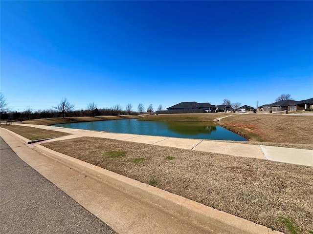 view of pool with a water view