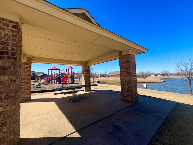 view of patio / terrace featuring a water view and playground community