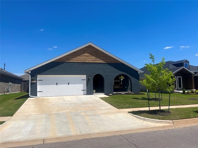 16340 Cold Fire Rd, Oklahoma City, OK 73170 - single story home featuring concrete driveway, a front yard, a garage, and brick siding