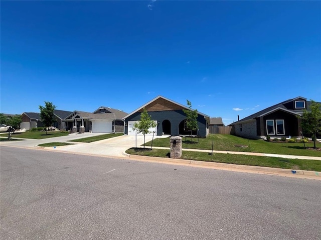 16340 Cold Fire Rd, Oklahoma City, OK 73170 - ranch-style home featuring concrete driveway, a front lawn, and an attached garage