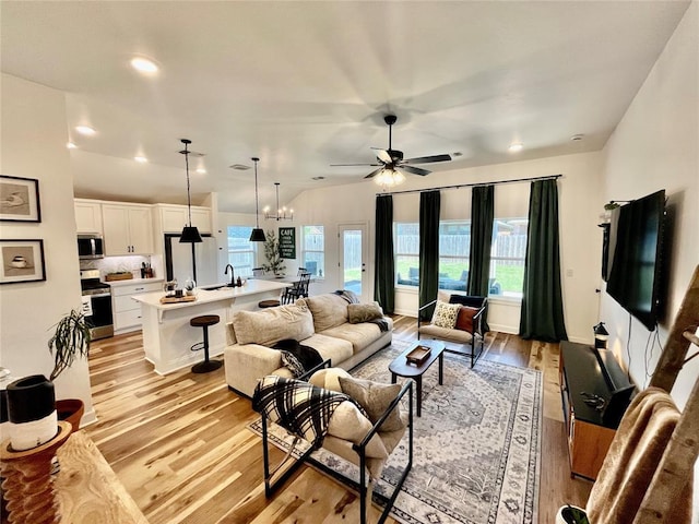 16340 Cold Fire Rd, Oklahoma City, OK 73170 - living area with light wood-type flooring, a ceiling fan, healthy amount of natural light, and recessed lighting