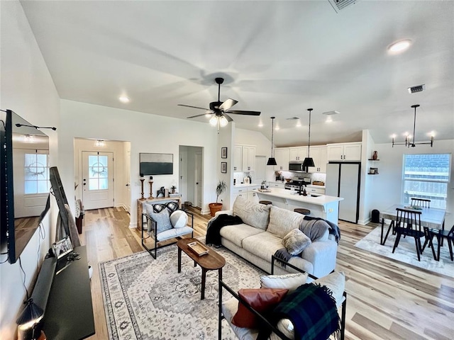 16340 Cold Fire Rd, Oklahoma City, OK 73170 - living room with a chandelier, plenty of natural light, light wood-type flooring, and a ceiling fan